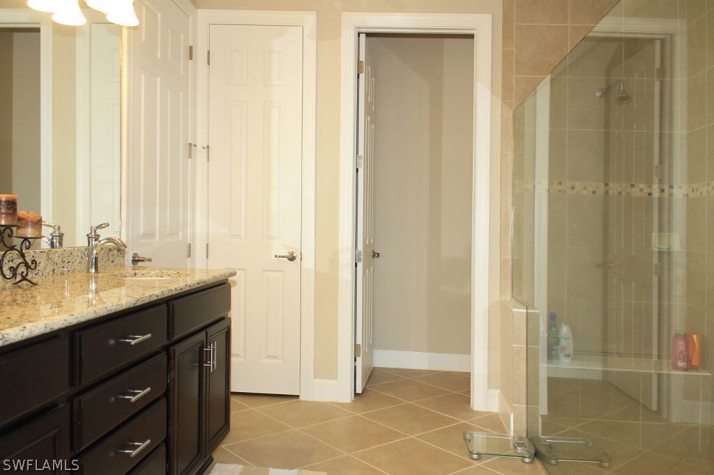 10874 Rutherford Road Fort Myers, FL 33913 - Photo 19 of 24 a bathroom with a shower sink and mirror