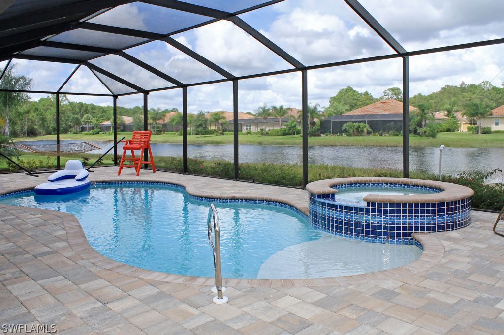 10874 Rutherford Road Fort Myers, FL 33913 - Photo 2 of 24 a view of swimming pool from a dining room with balcony