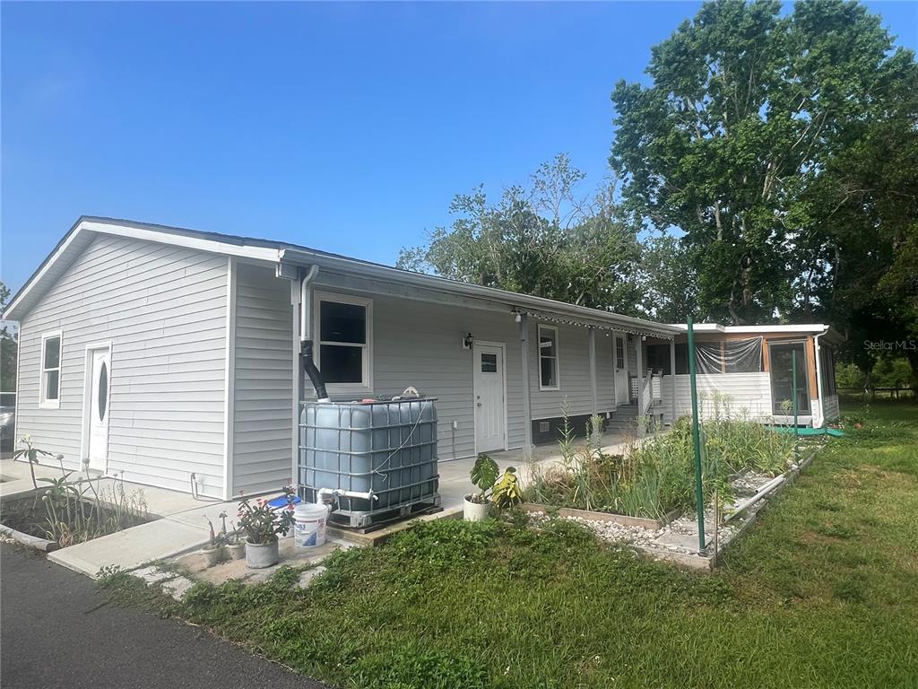 5855 Jack Brack Road St. Cloud, FL 34771 - Photo 22 of 86 a view of a house with a yard