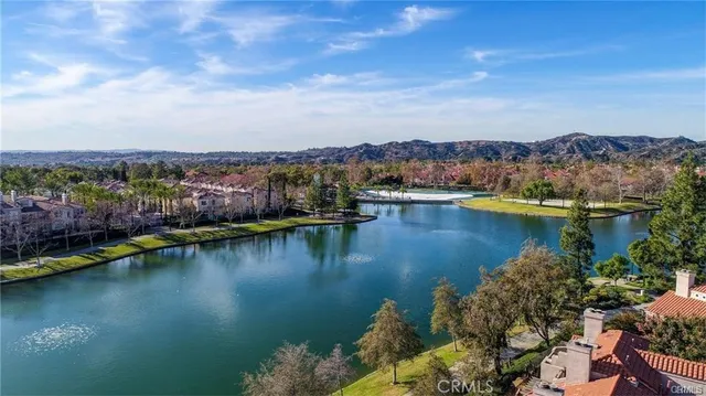 a view of a swimming pool with a table and chairs