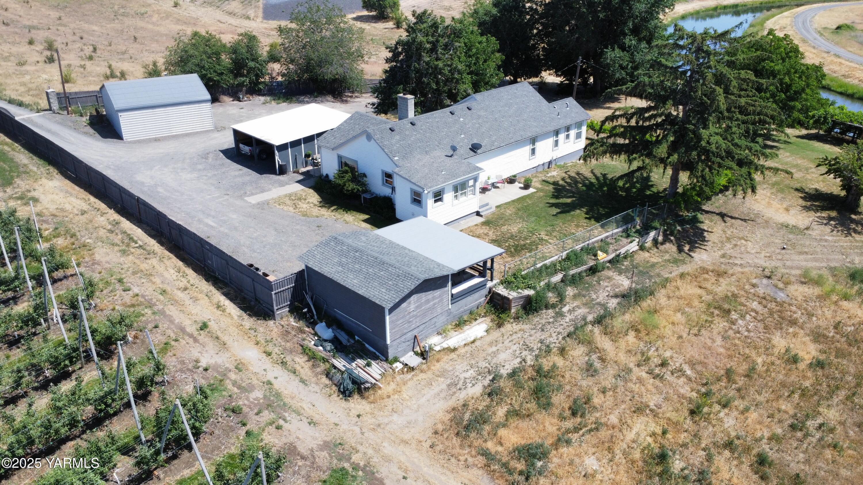 an aerial view of residential house with outdoor space