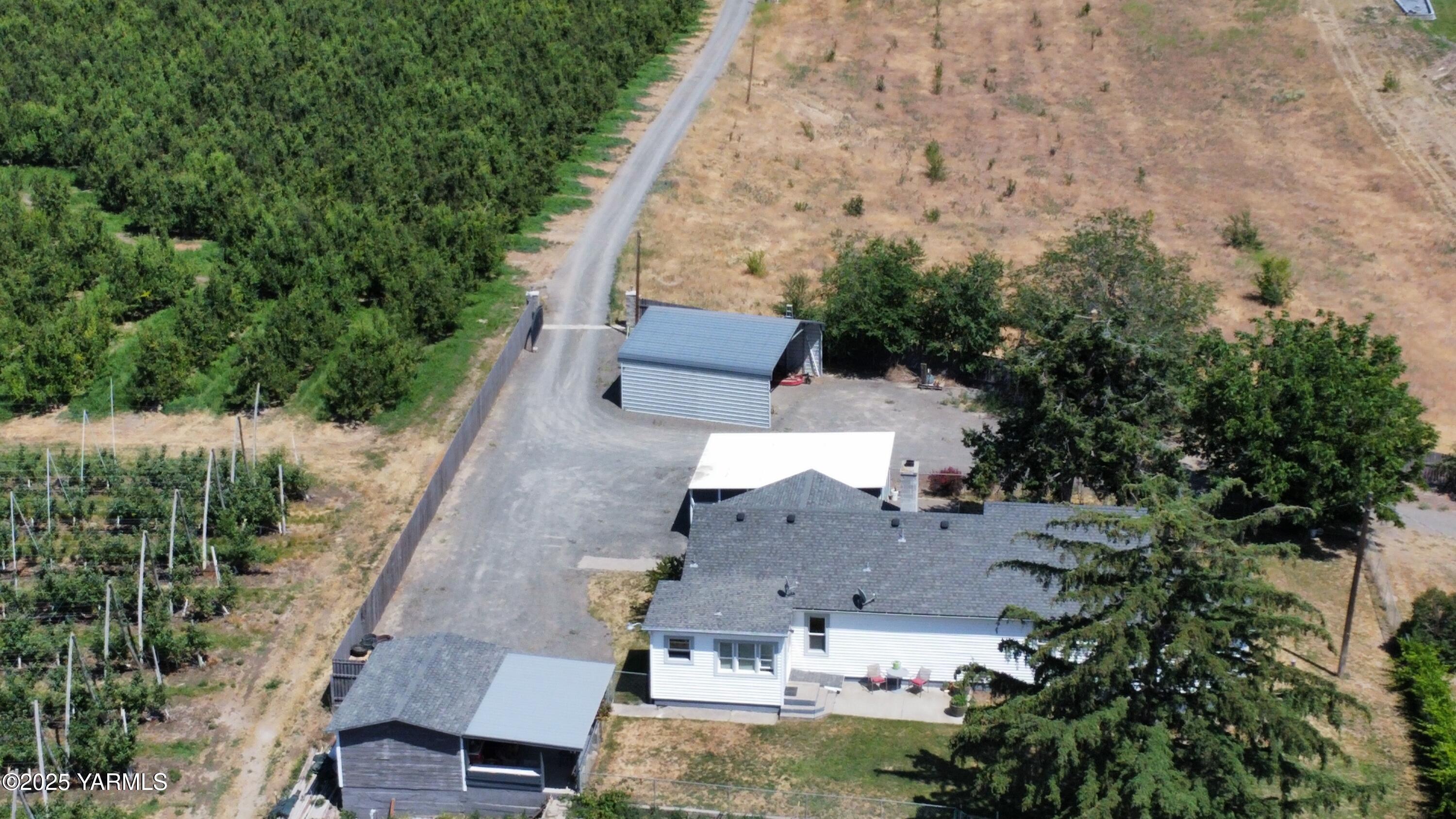960 Knight Hill Road Zillah, WA 98953 - Photo 4 of 21 an aerial view of residential houses with outdoor space