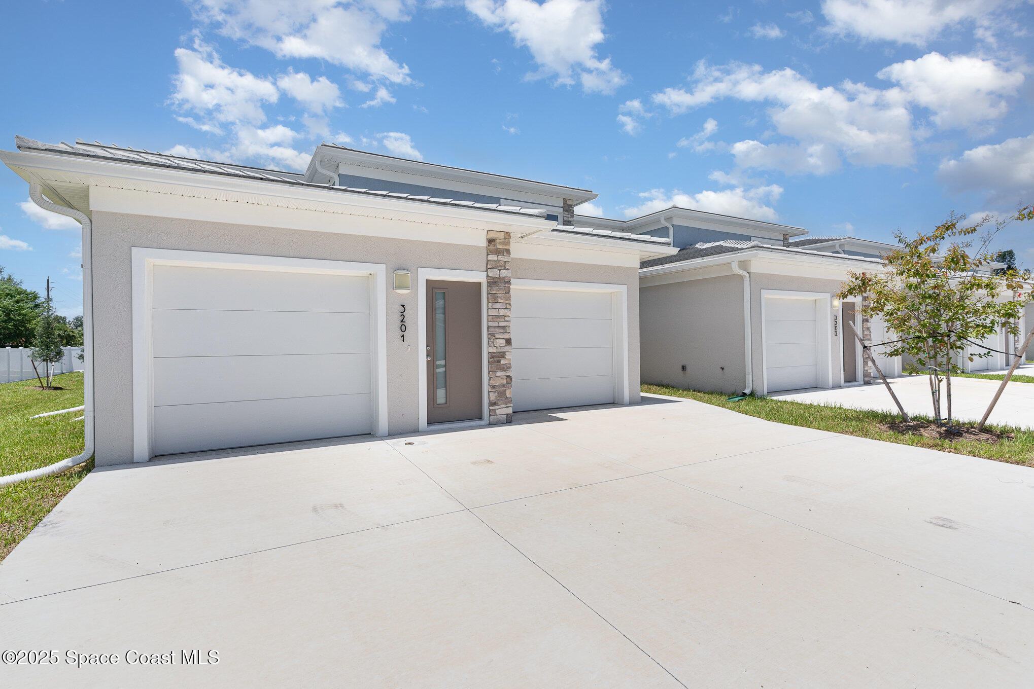 1605 Par Street Northeast, Unit 3201 Palm Bay, FL 32905 - Photo 34 of 42 a view of a house with a yard