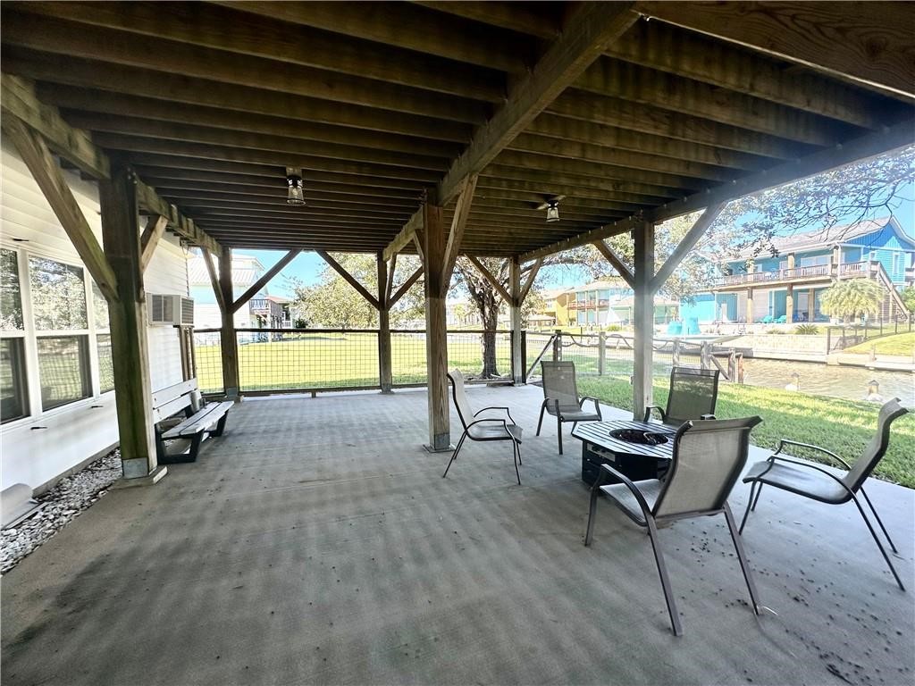 39 Front Street Rockport, TX 78382 - Photo 30 of 38 a view of a porch with furniture and a yard