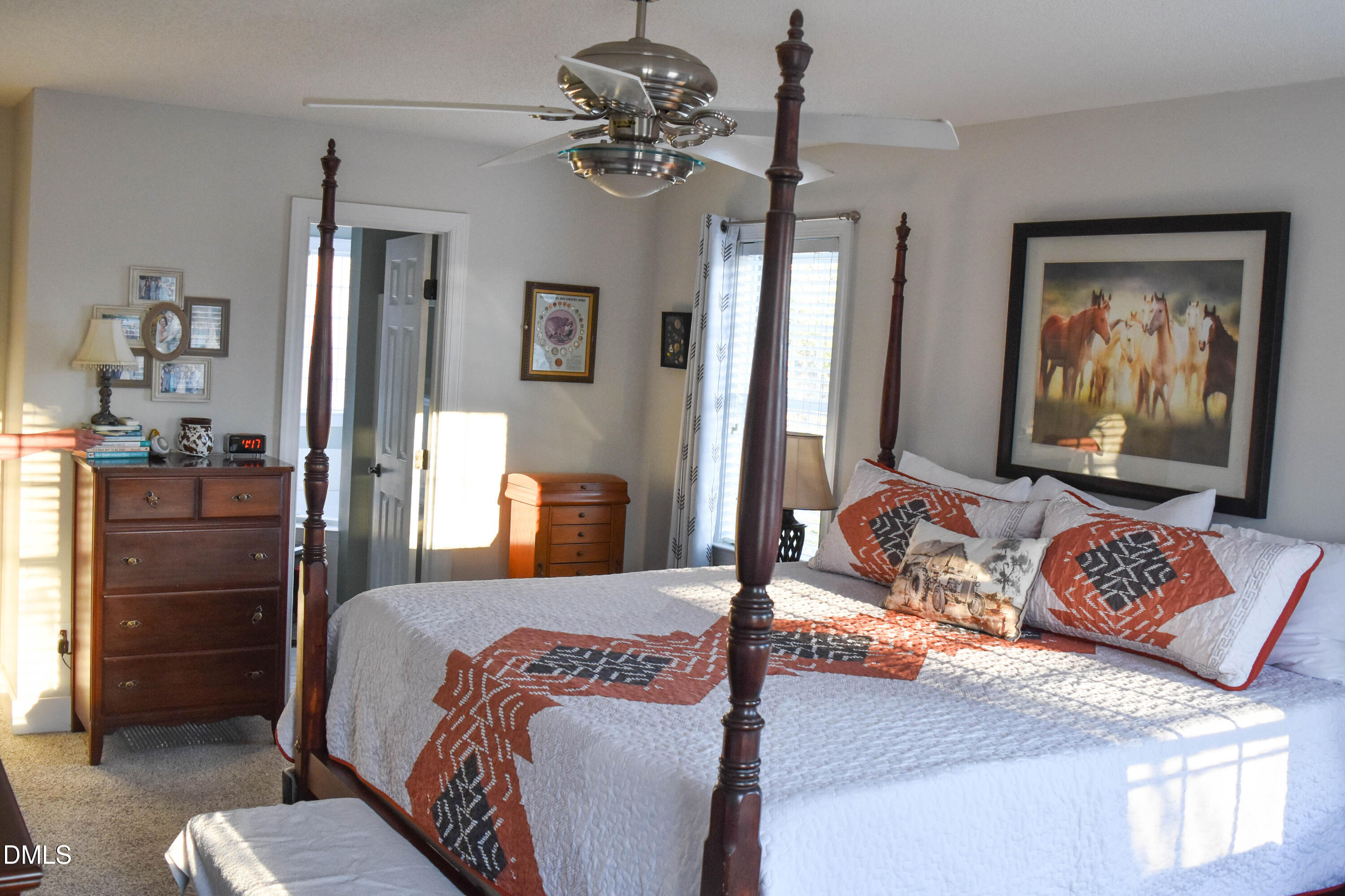 5908 Deep Spring Circle Wake Forest, NC 27587 - Photo 20 of 51 a bedroom with a bed and dresser with mirror