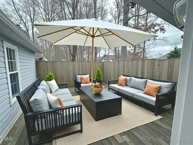 a view of a deck with furniture and a umbrella