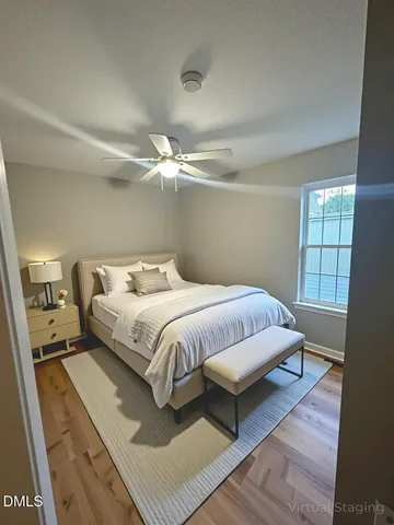 a bedroom with a bed and window