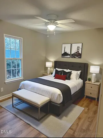a bedroom with a bed and window