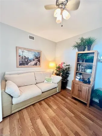 a spacious bedroom with a bed window and couch