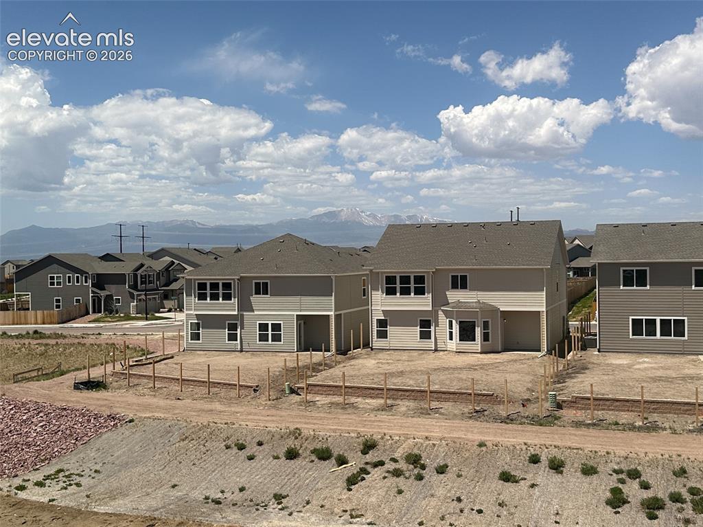 8230 Lemon Grass Road Falcon, CO 80831 - Photo 22 of 22 a big house with a big yard and large trees