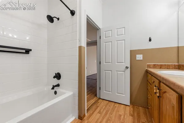 a bathroom with a bathtub and a shower
