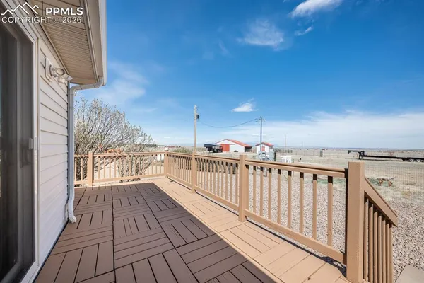 a view of balcony with wooden floor
