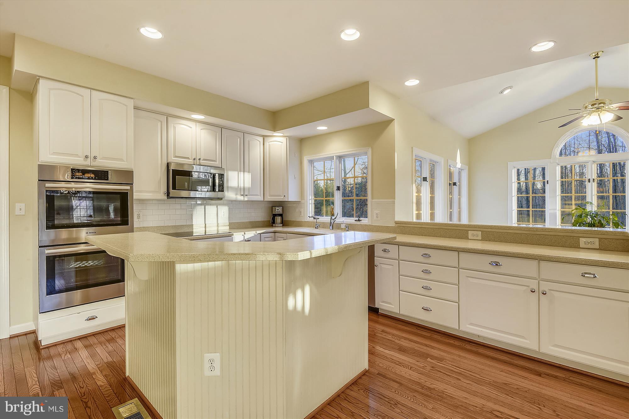 2019 Gresham Lane Davidsonville, MD 21035 - Photo 20 of 85 a kitchen with stainless steel appliances granite countertop a stove top oven a sink and dishwasher a refrigerator with wooden floor