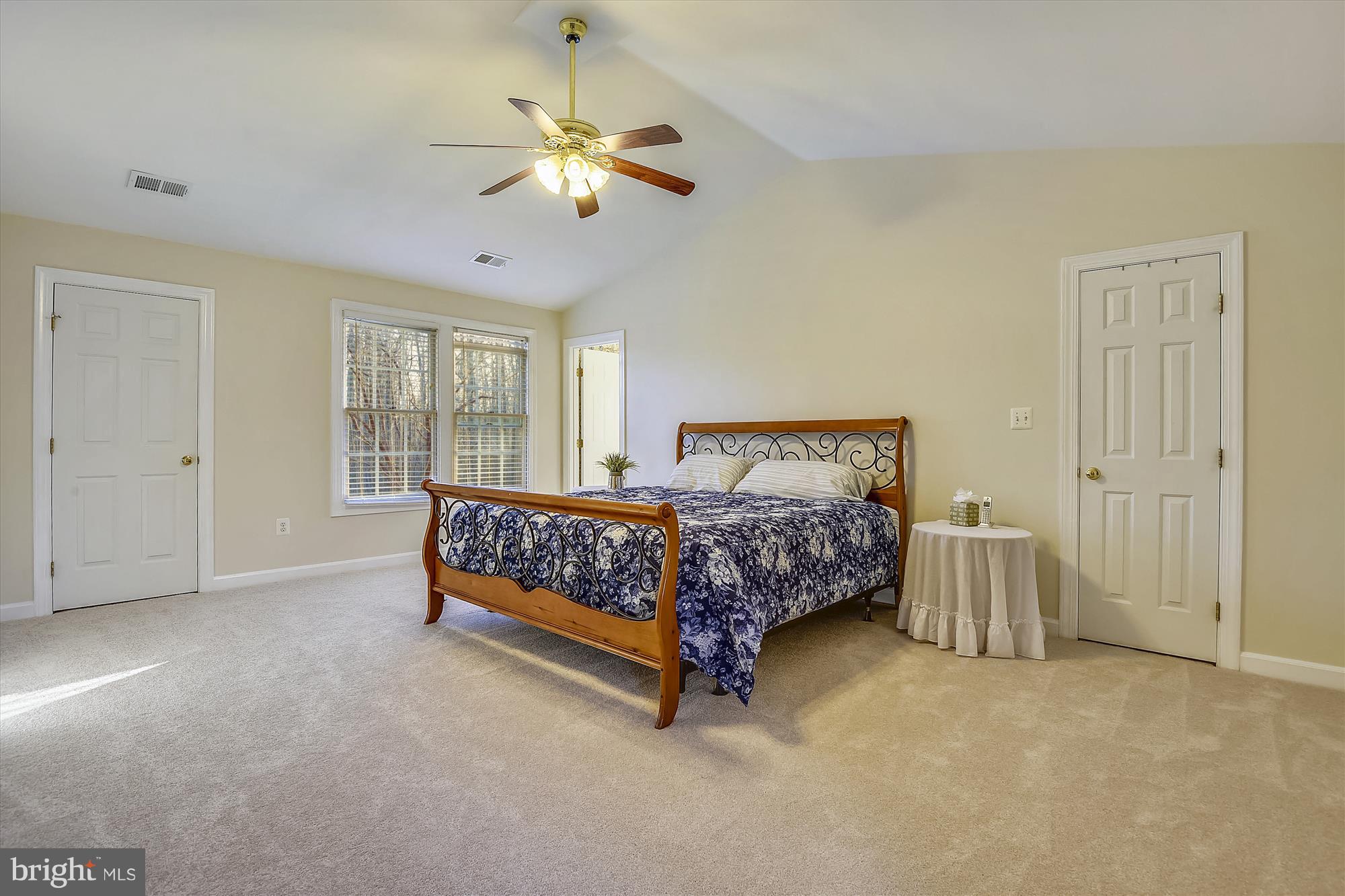 2019 Gresham Lane Davidsonville, MD 21035 - Photo 37 of 85 a bedroom with a bed and a chandelier