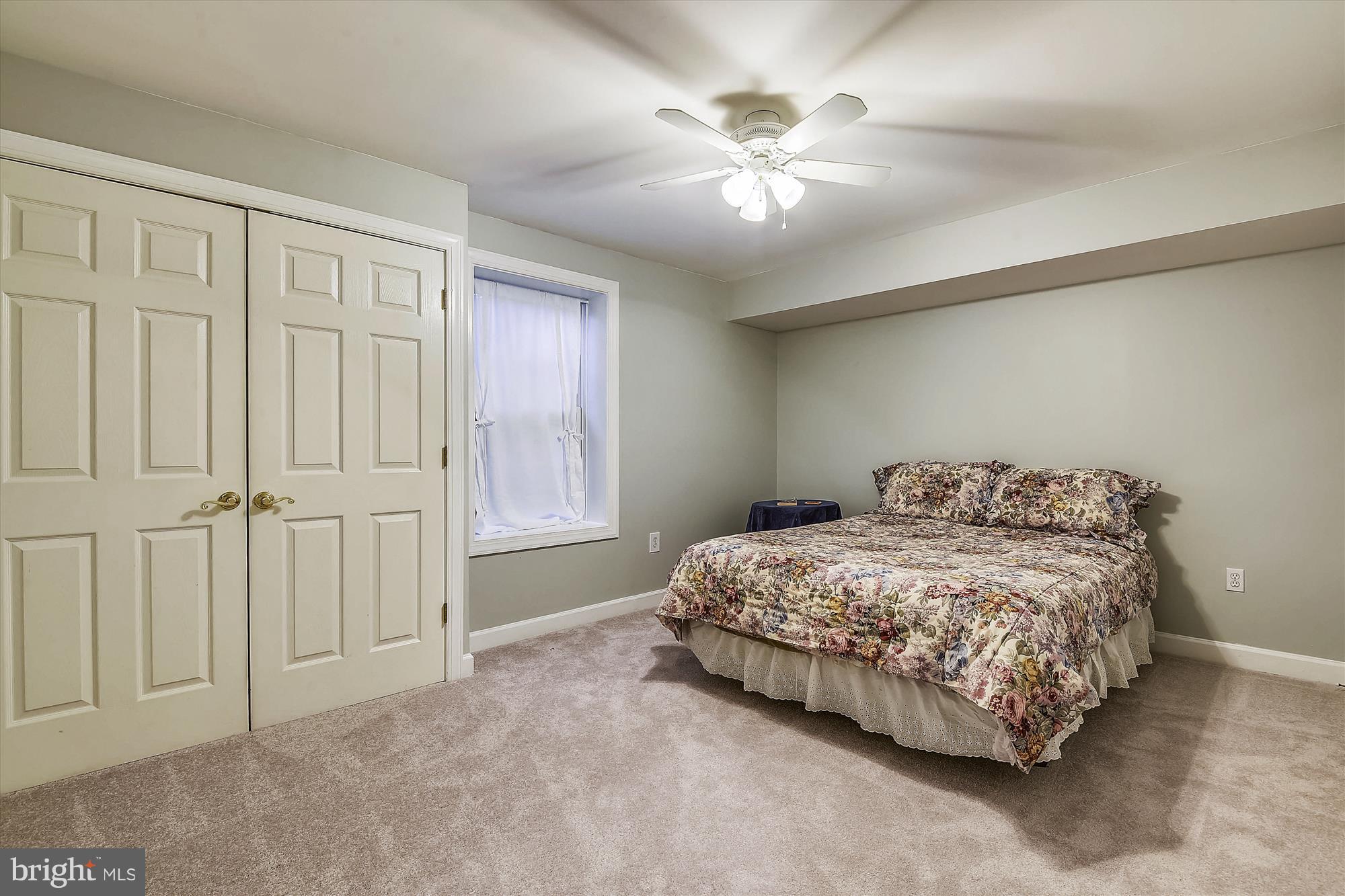2019 Gresham Lane Davidsonville, MD 21035 - Photo 56 of 85 a bedroom with a bed and a chandelier