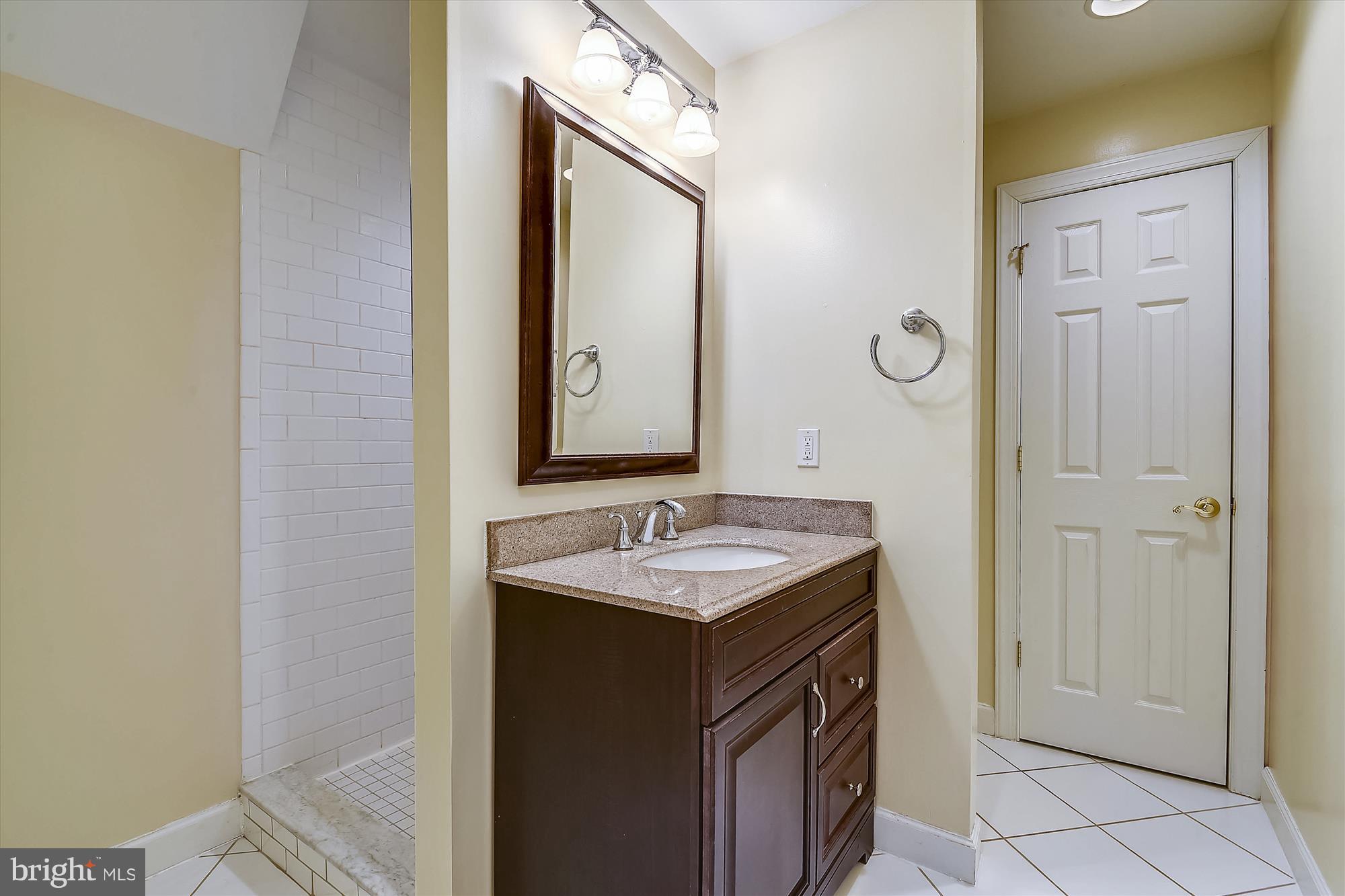 2019 Gresham Lane Davidsonville, MD 21035 - Photo 58 of 85 a bathroom with a sink and a mirror
