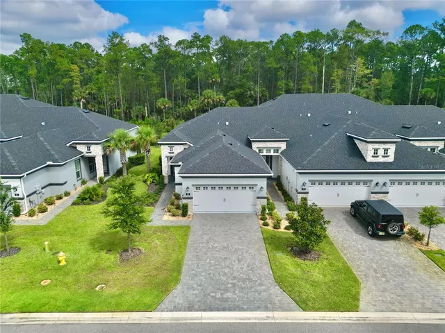 an aerial view of a house with a garden