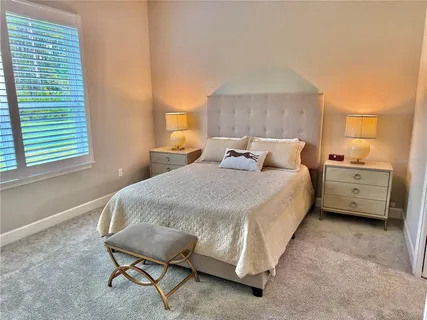 a bedroom with a bed and a cabinets