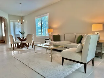 a kitchen with stainless steel appliances granite countertop a sink refrigerator and microwave