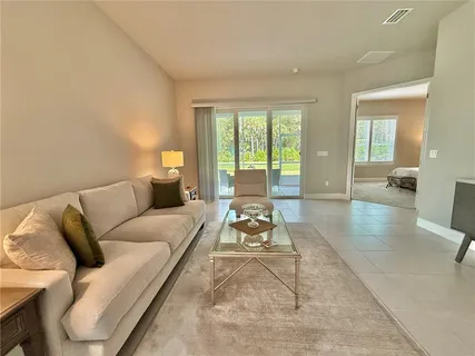 an aerial view of residential houses with outdoor space and swimming pool