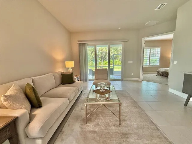 an aerial view of residential houses with outdoor space and swimming pool