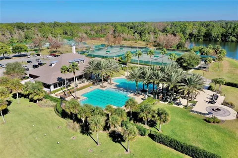 a view of a lake with a houses in the back