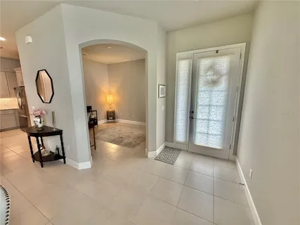 a view of a livingroom with furniture and front door