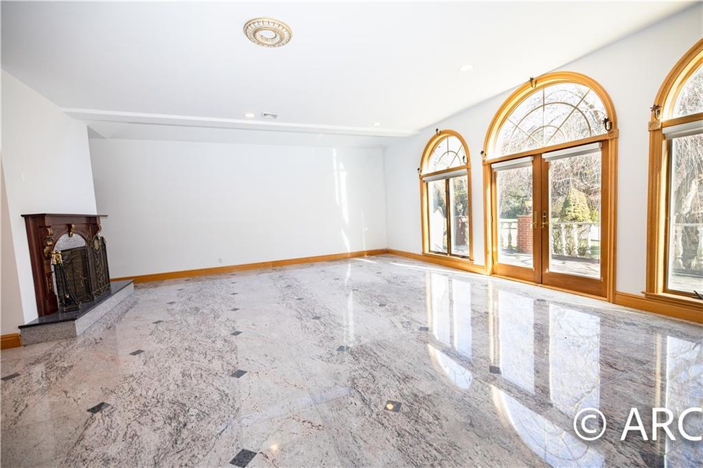 66 Wolver Hollow Road Glen Head, NY 11545 - Photo 13 of 46 a view of a room with wooden floor and window