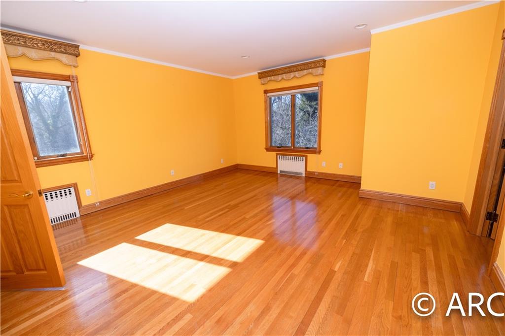 66 Wolver Hollow Road Glen Head, NY 11545 - Photo 25 of 46 a view of an empty room and wooden floor