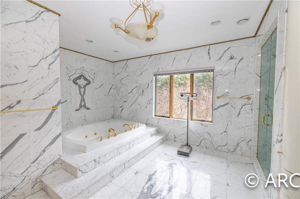 66 Wolver Hollow Road Glen Head, NY 11545 - Photo 36 of 46 a bathroom with a bathtub and shower