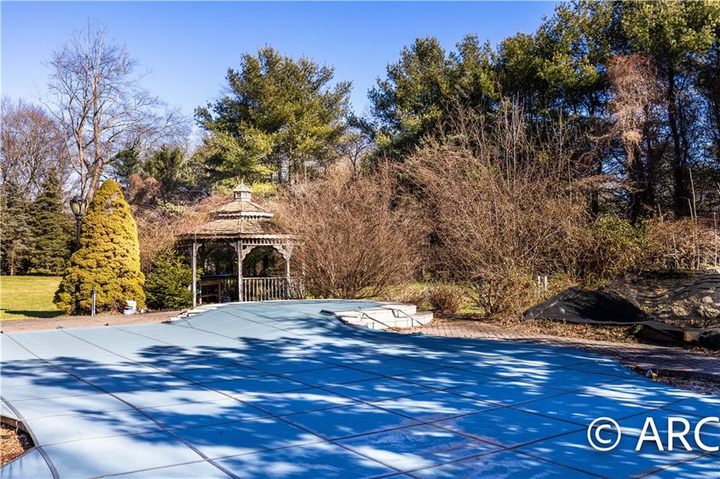 66 Wolver Hollow Road Glen Head, NY 11545 - Photo 42 of 46 a front view of a house with a yard