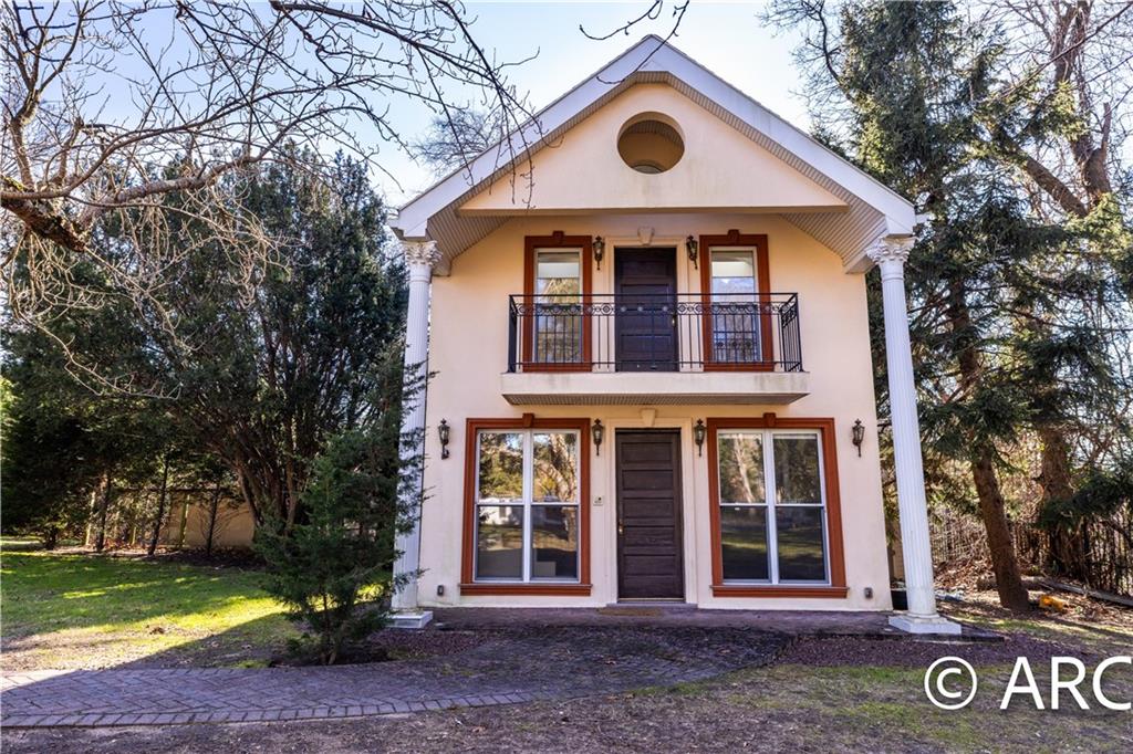 66 Wolver Hollow Road Glen Head, NY 11545 - Photo 44 of 46 a front view of a house with garden