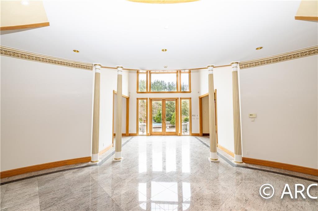 66 Wolver Hollow Road Glen Head, NY 11545 - Photo 9 of 46 a view of an empty room with a window
