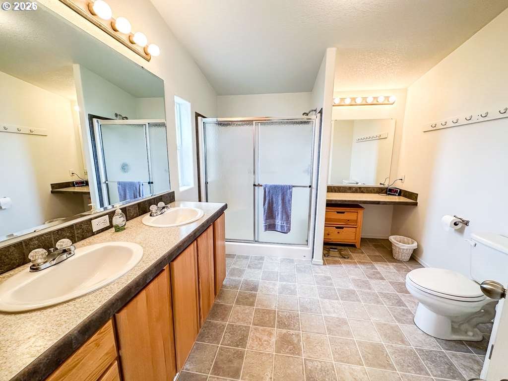 46198 Slaughterhouse Road Halfway, OR 97834 - Photo 14 of 40 a bathroom with a sink toilet and shower
