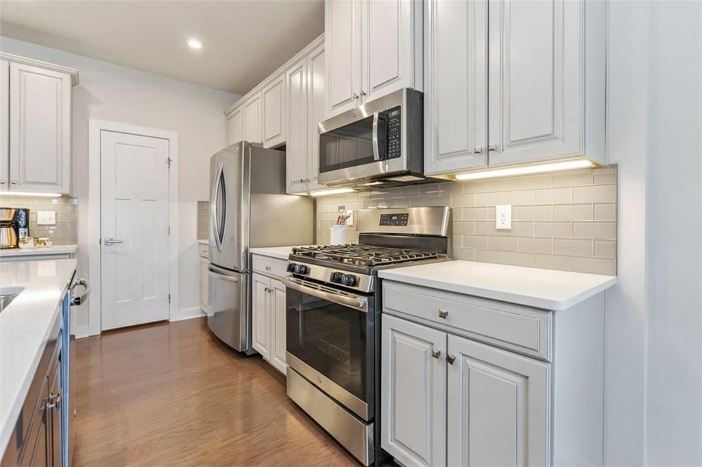 235 Regency Drive Eighty Four, PA 15330 - Photo 14 of 37 a kitchen with stainless steel appliances white cabinets and a refrigerator