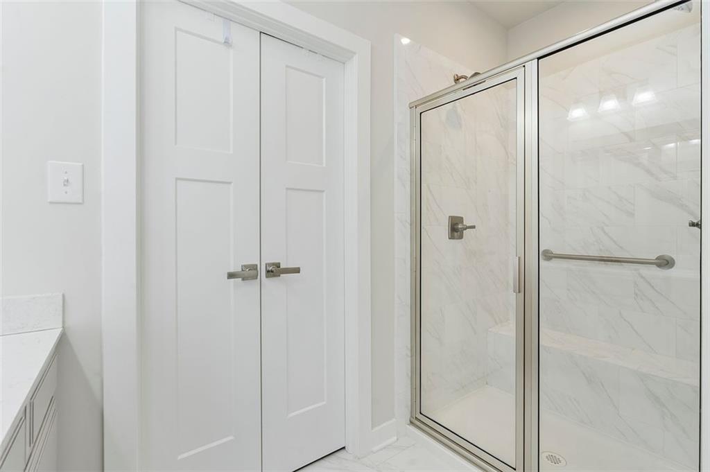 235 Regency Drive Eighty Four, PA 15330 - Photo 23 of 37 a bathroom with a glass shower door