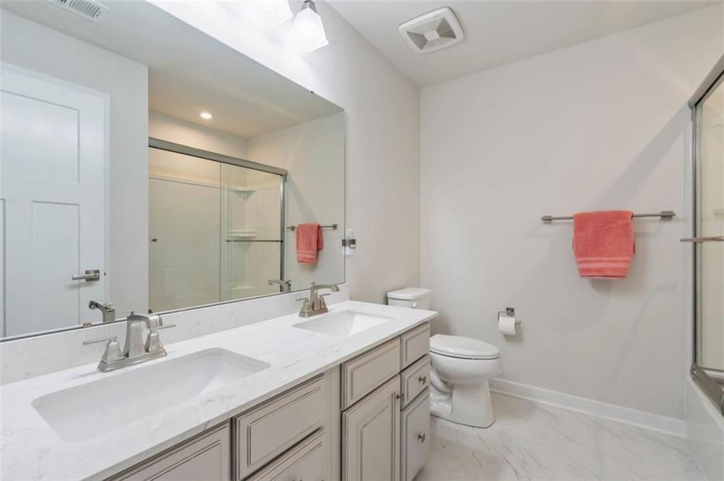235 Regency Drive Eighty Four, PA 15330 - Photo 29 of 37 a bathroom with a sink vanity mirror and toilet