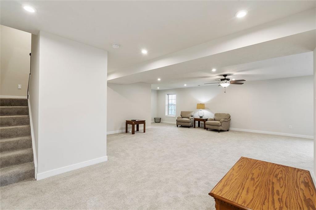 235 Regency Drive Eighty Four, PA 15330 - Photo 31 of 37 a view of a livingroom with furniture and a ceiling fan