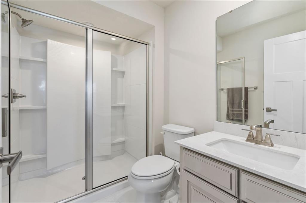 235 Regency Drive Eighty Four, PA 15330 - Photo 32 of 37 a bathroom with a granite countertop sink toilet and shower