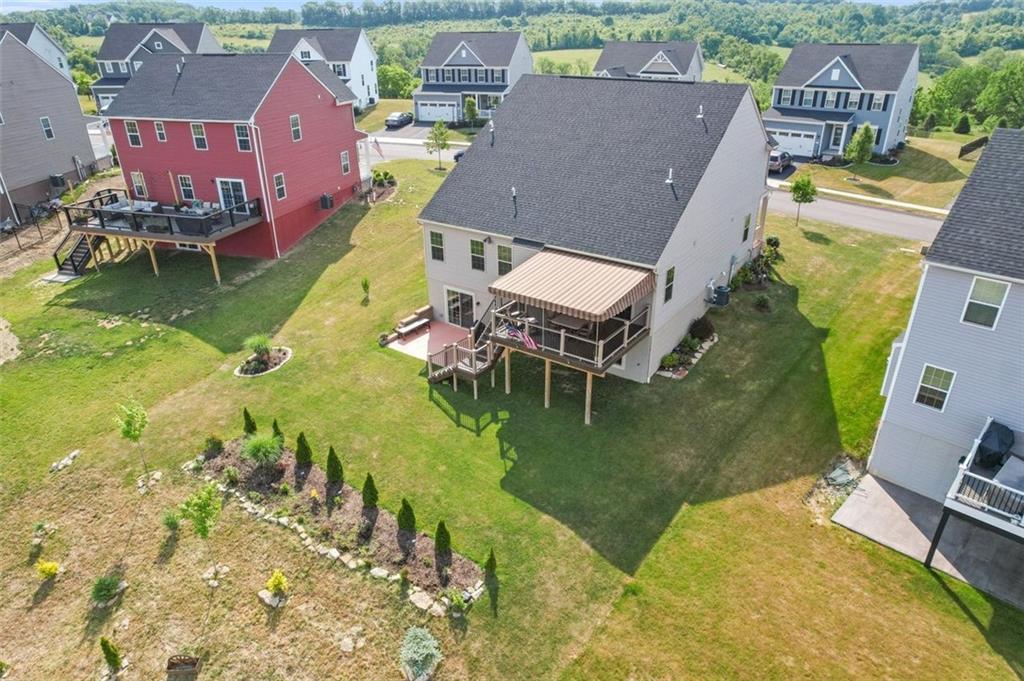 235 Regency Drive Eighty Four, PA 15330 - Photo 36 of 37 an aerial view of a house with swimming pool and a yard