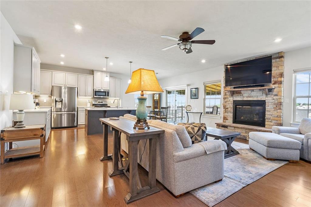 235 Regency Drive Eighty Four, PA 15330 - Photo 7 of 37 a living room with fireplace furniture and a wooden floor