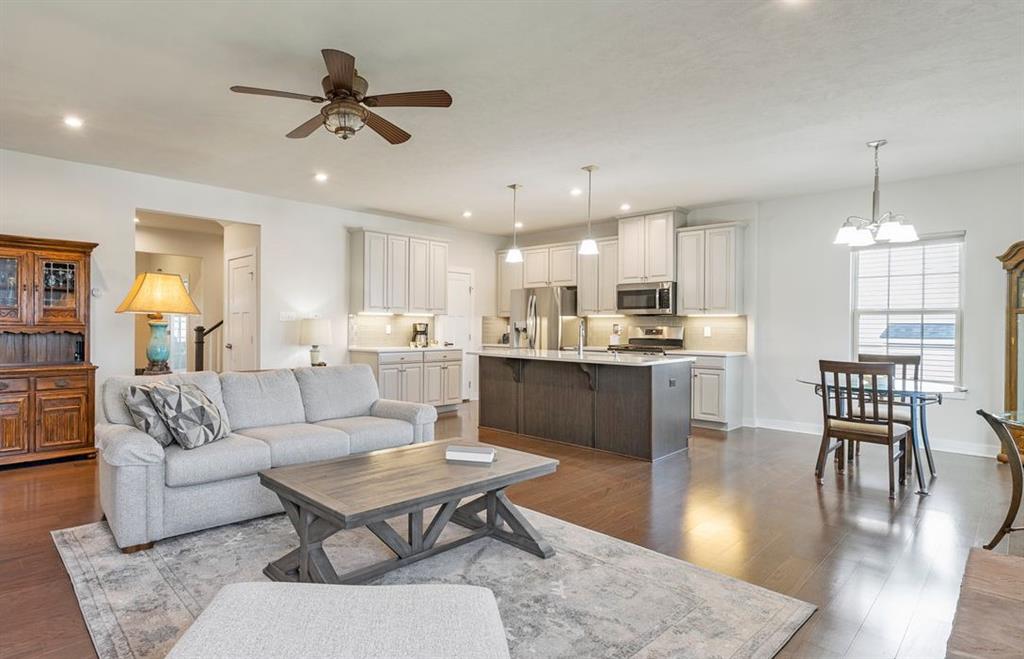 235 Regency Drive Eighty Four, PA 15330 - Photo 8 of 37 a living room with furniture kitchen view and a chandelier
