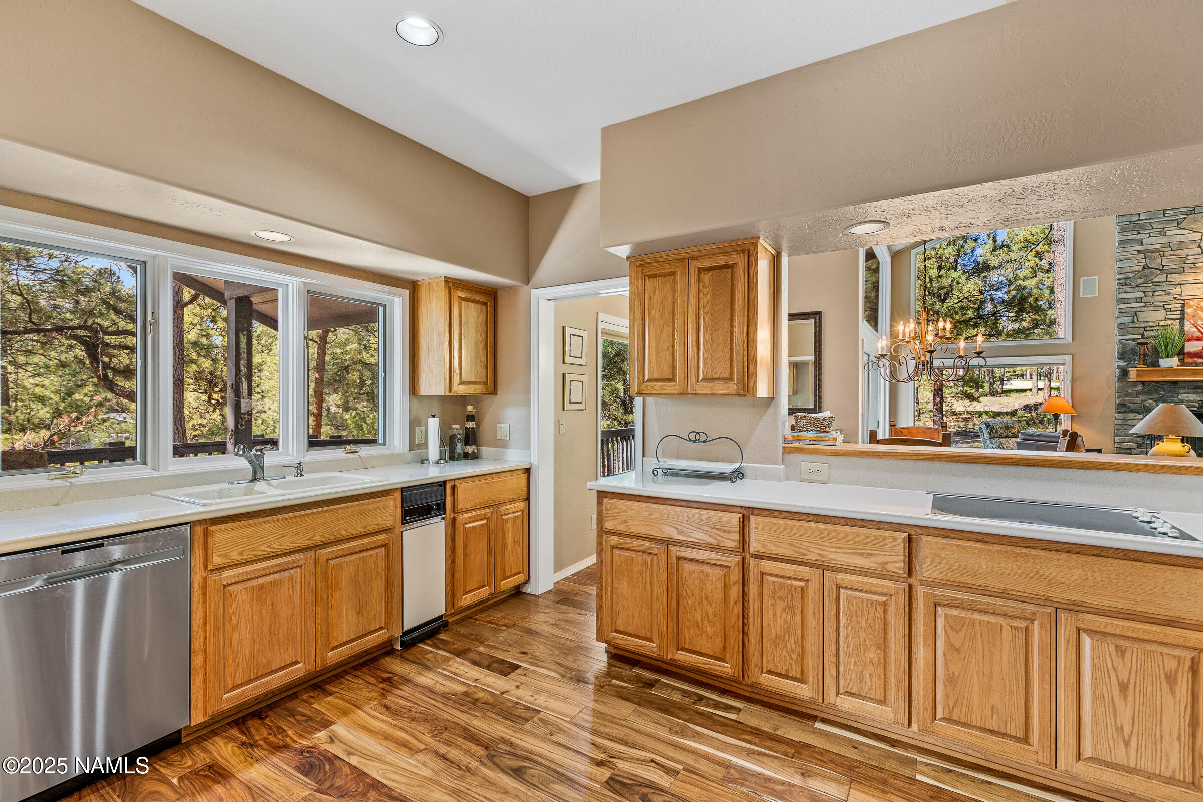 2252 Link Smith Flagstaff, AZ 86005 - Photo 16 of 53 a large kitchen with granite countertop a large window and white cabinets