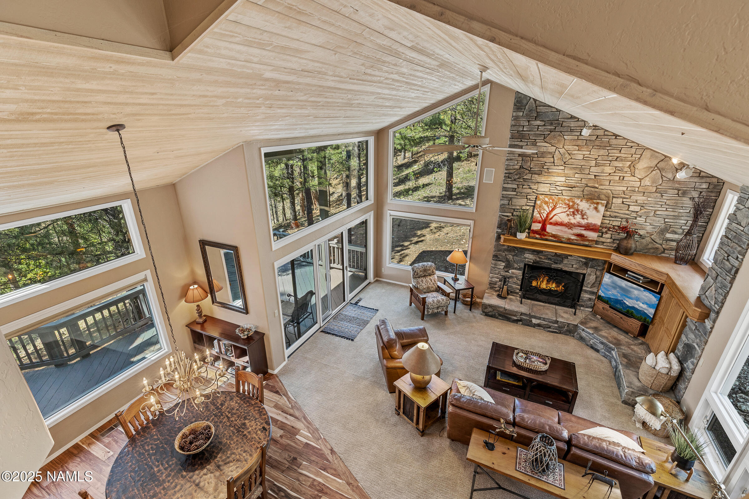 2252 Link Smith Flagstaff, AZ 86005 - Photo 29 of 53 a living room with furniture a flat screen tv and a window