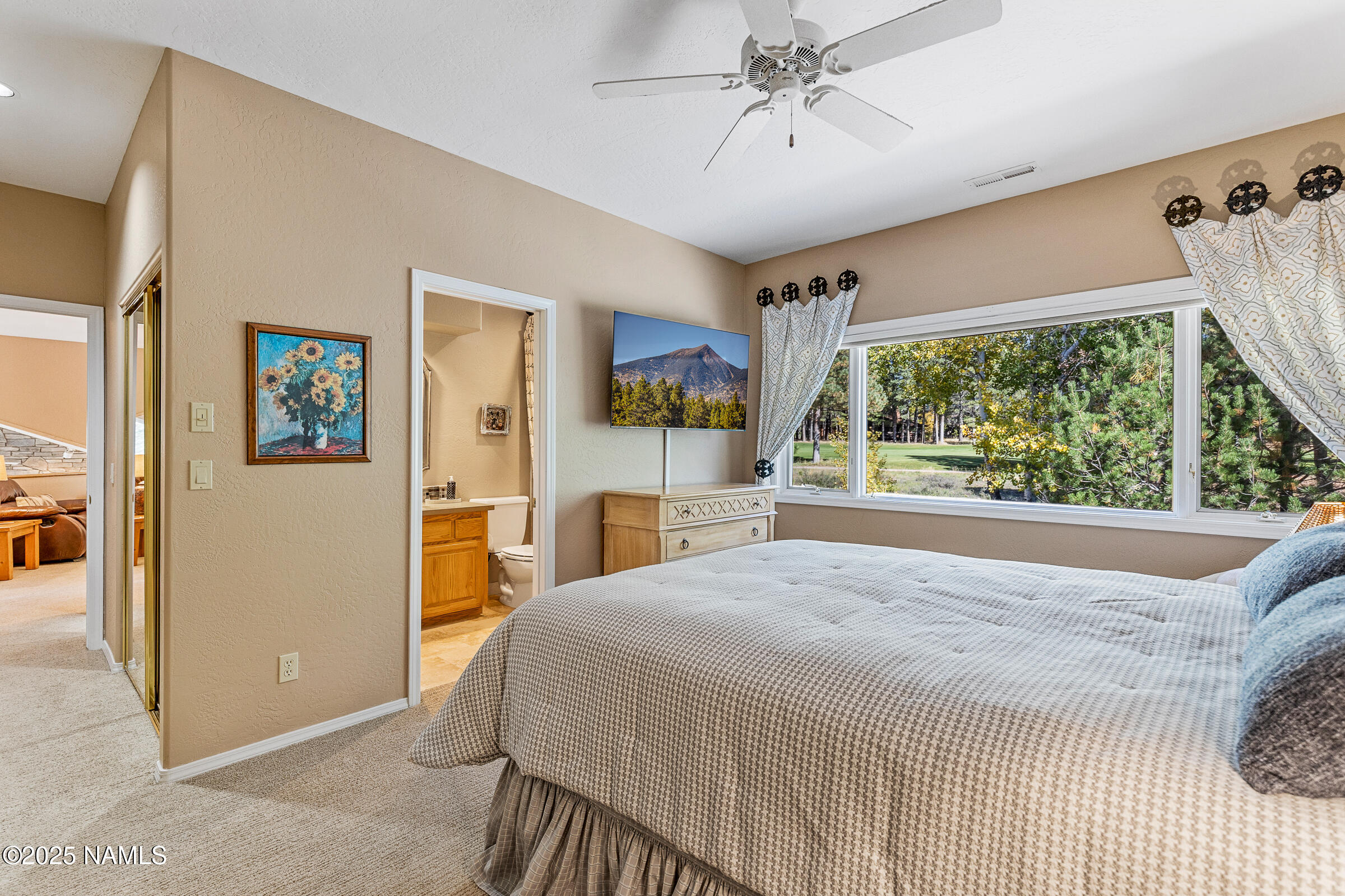 2252 Link Smith Flagstaff, AZ 86005 - Photo 33 of 53 a bedroom with a bed and a large window