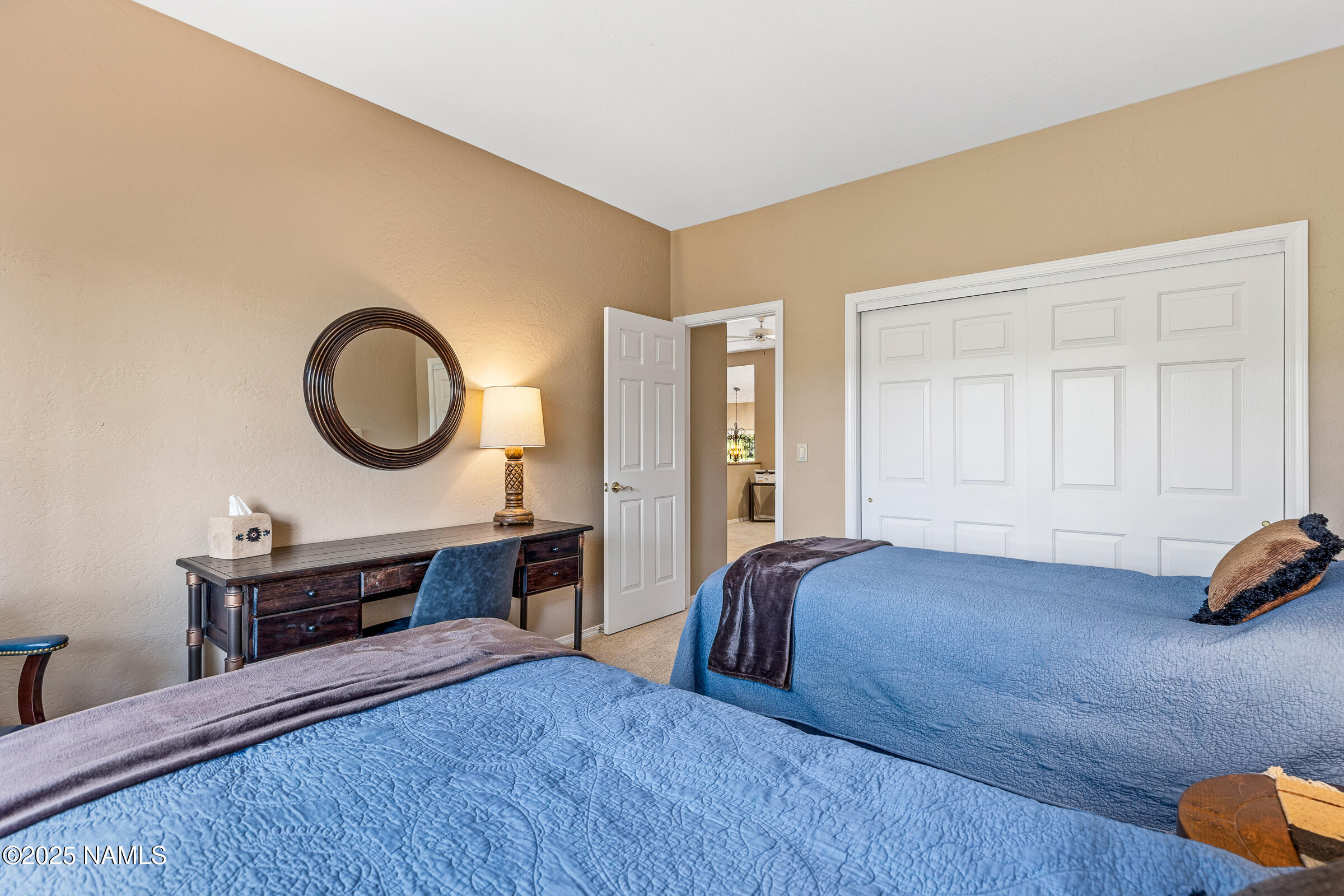 2252 Link Smith Flagstaff, AZ 86005 - Photo 36 of 53 a bedroom with a bed a dresser and chair