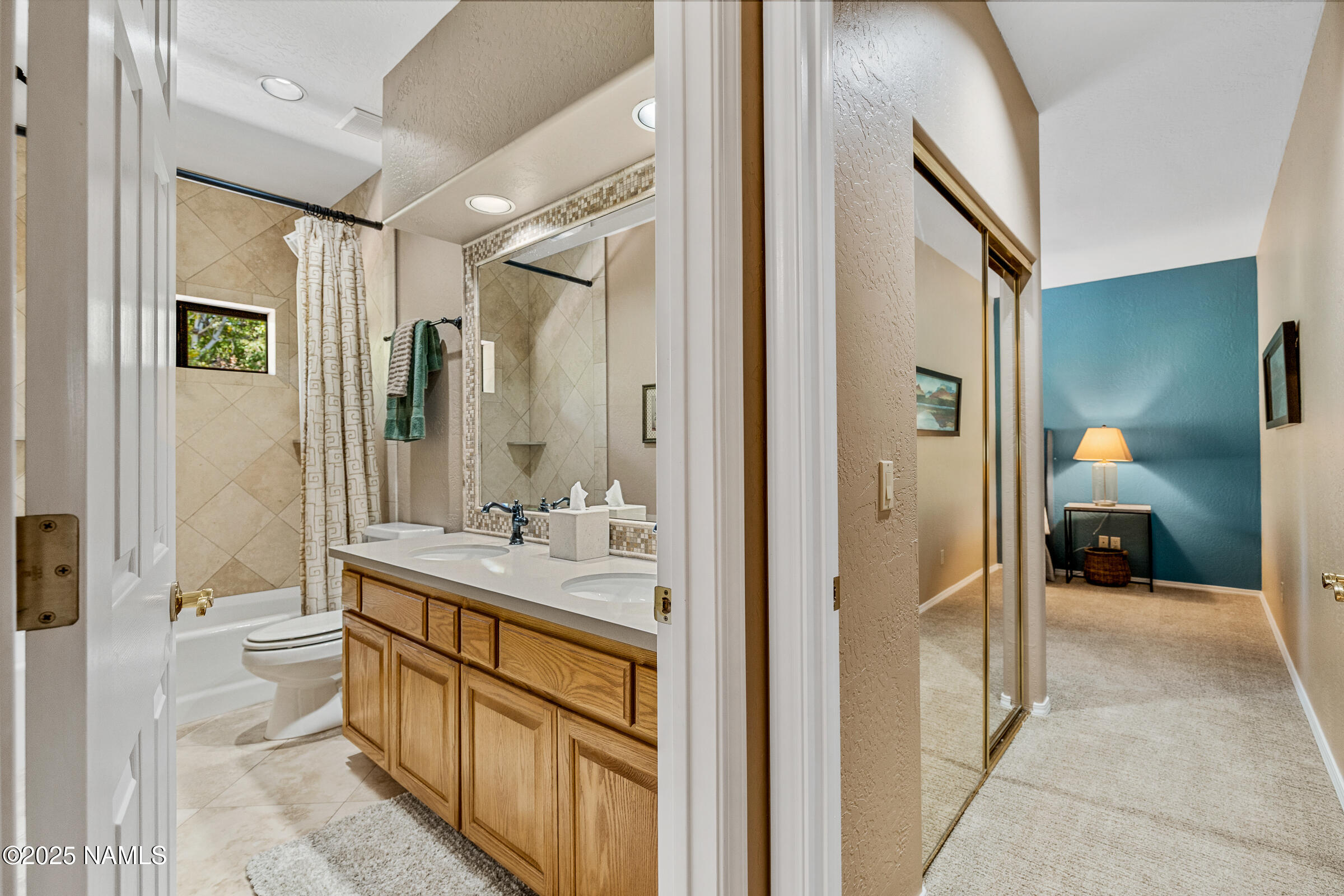 2252 Link Smith Flagstaff, AZ 86005 - Photo 37 of 53 a bathroom with a sink a mirror and a shower