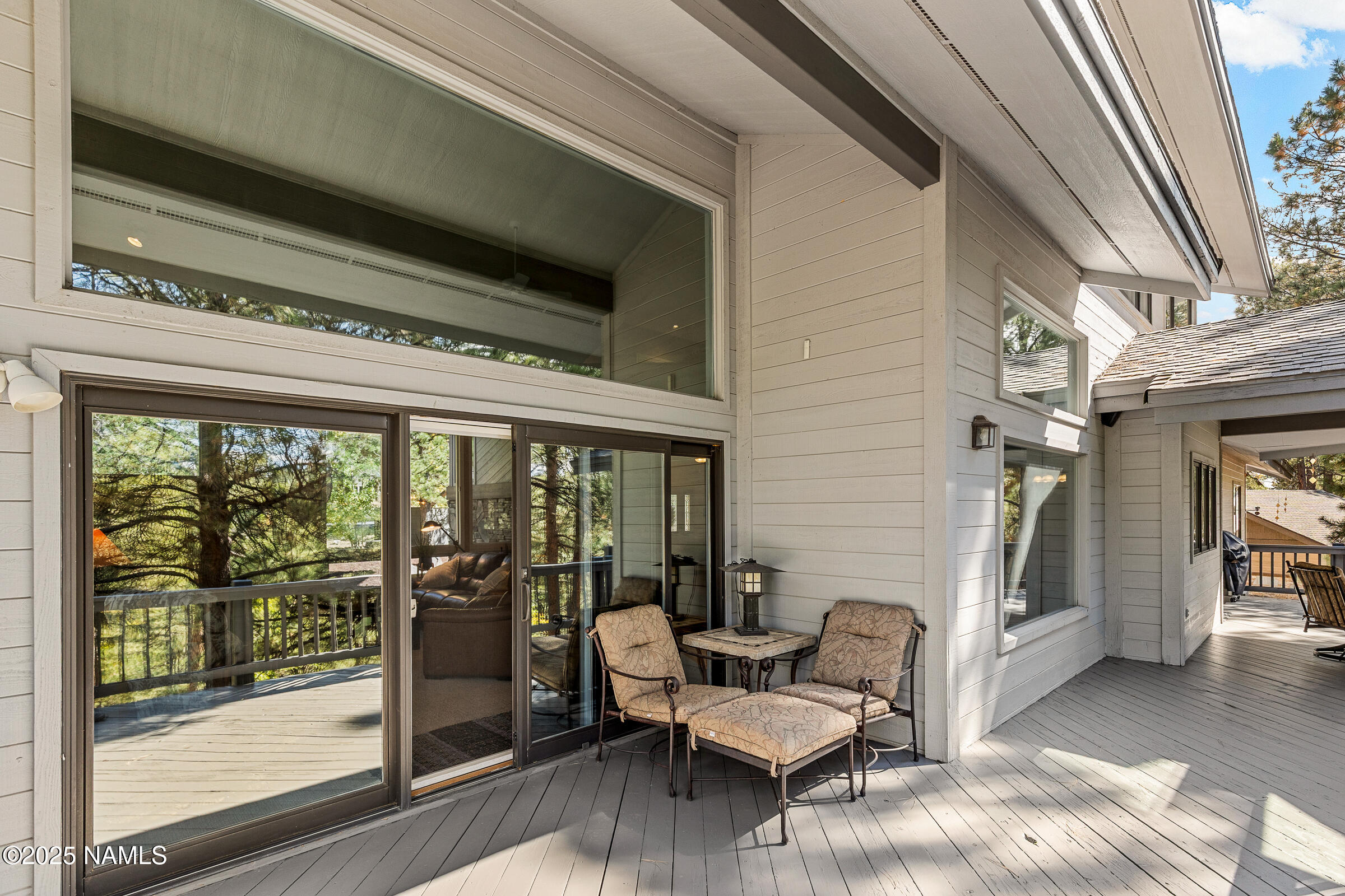 2252 Link Smith Flagstaff, AZ 86005 - Photo 47 of 53 a living room with furniture and a floor to ceiling window