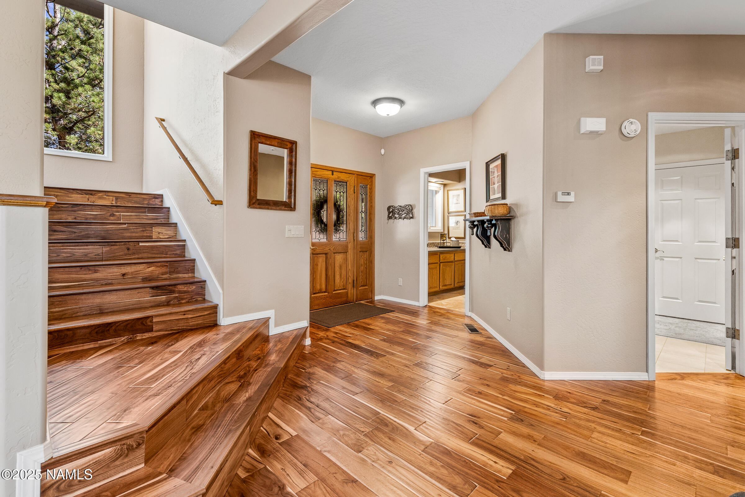 2252 Link Smith Flagstaff, AZ 86005 - Photo 8 of 53 a view of a livingroom with wooden floor and stairs