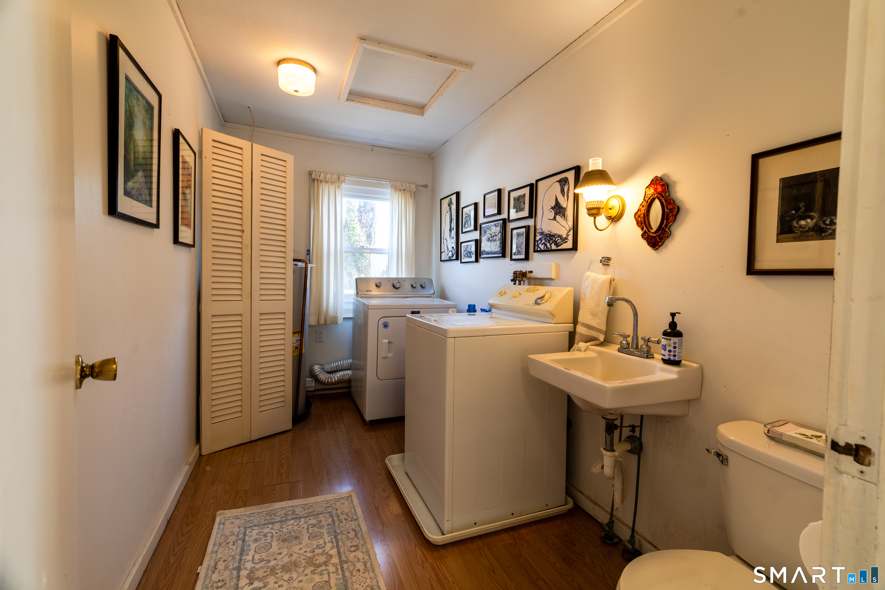 226 Pequot Avenue Groton, CT 06355 - Photo 11 of 11 a bathroom with a sink mirror and toilet